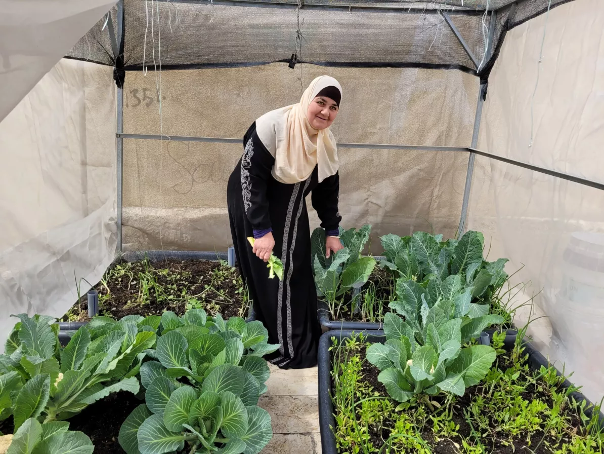 Woman standing in her rooftop garden