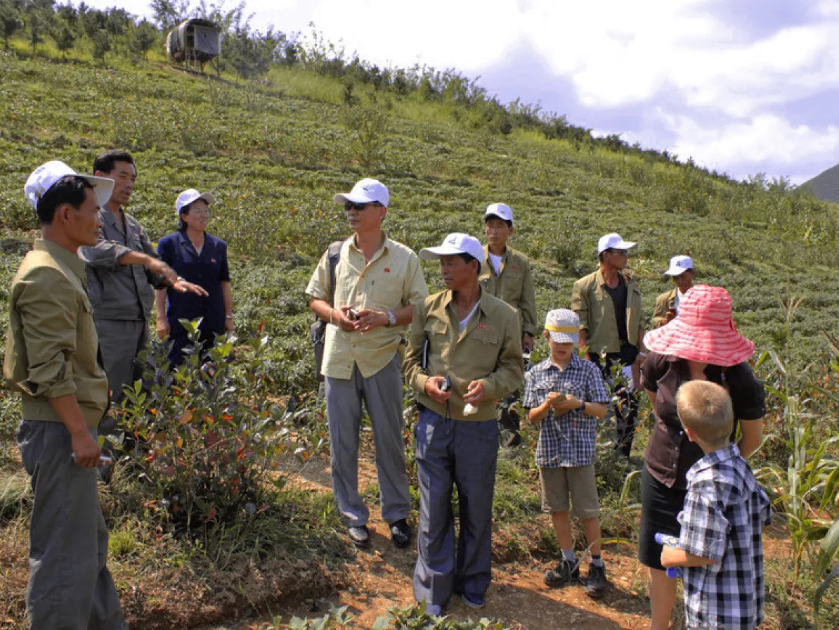 A group of people standing in a field