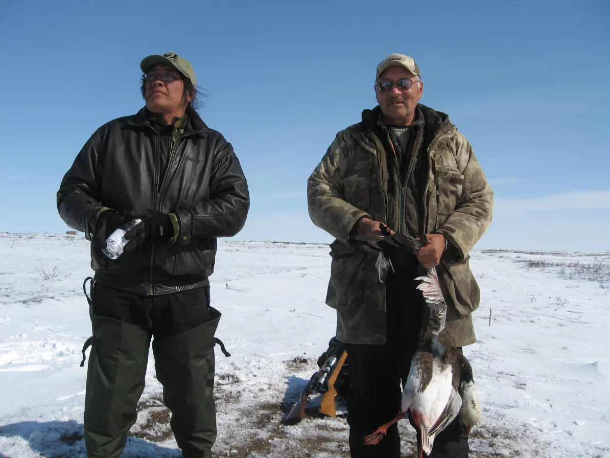 Two men hunting geese