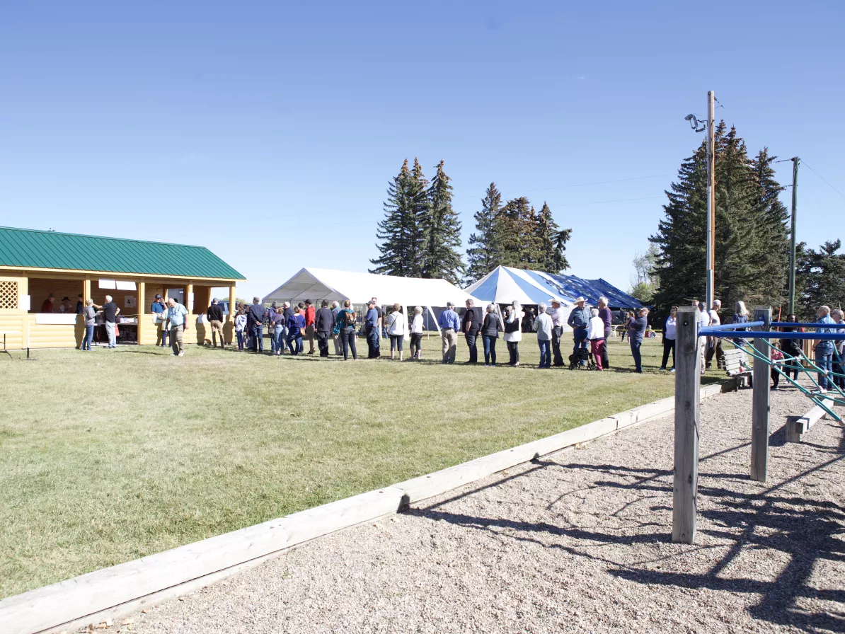 A line of people ordering food