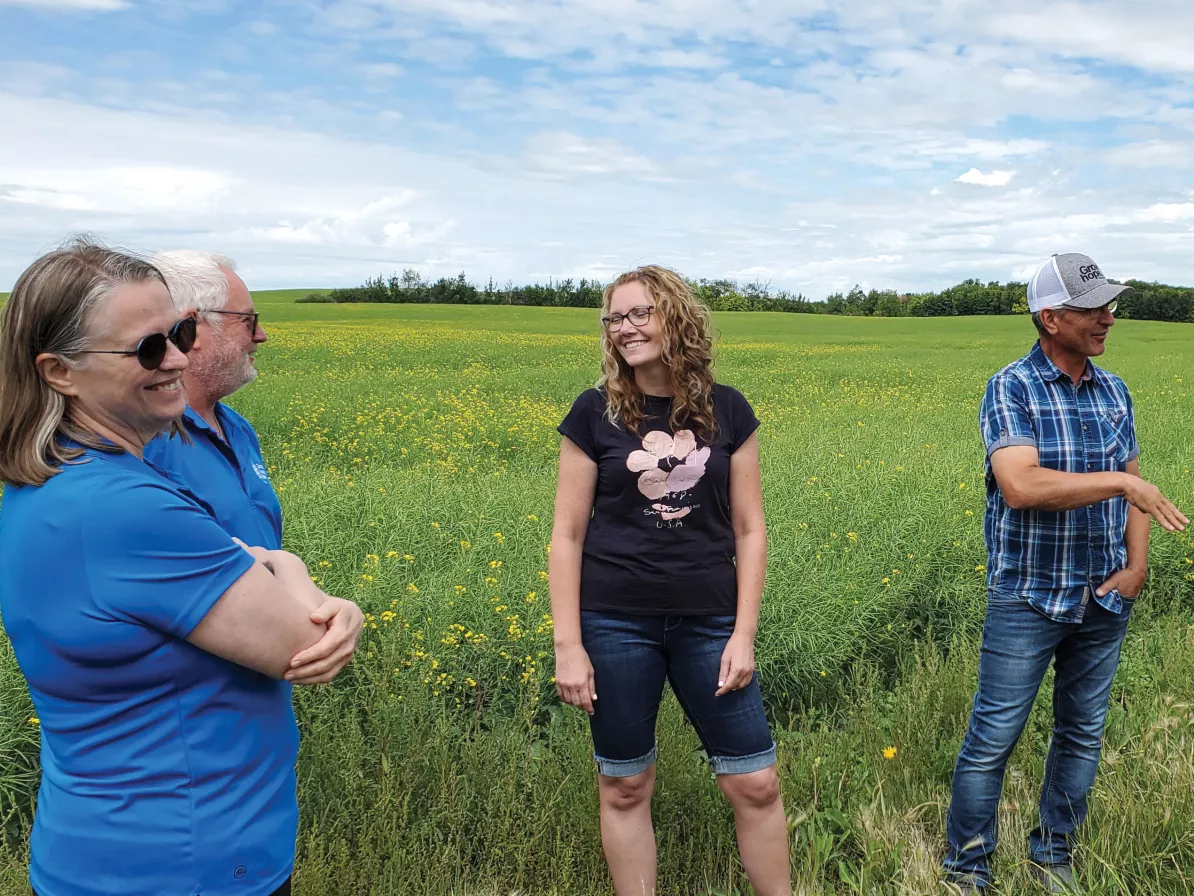 A group of people standing in a field