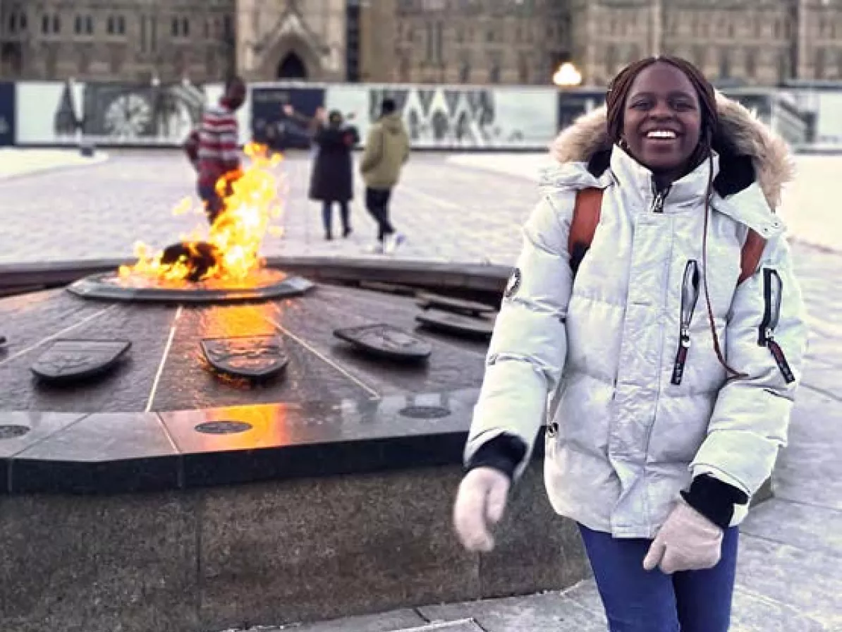 A young woman smiling on Parliament Hill