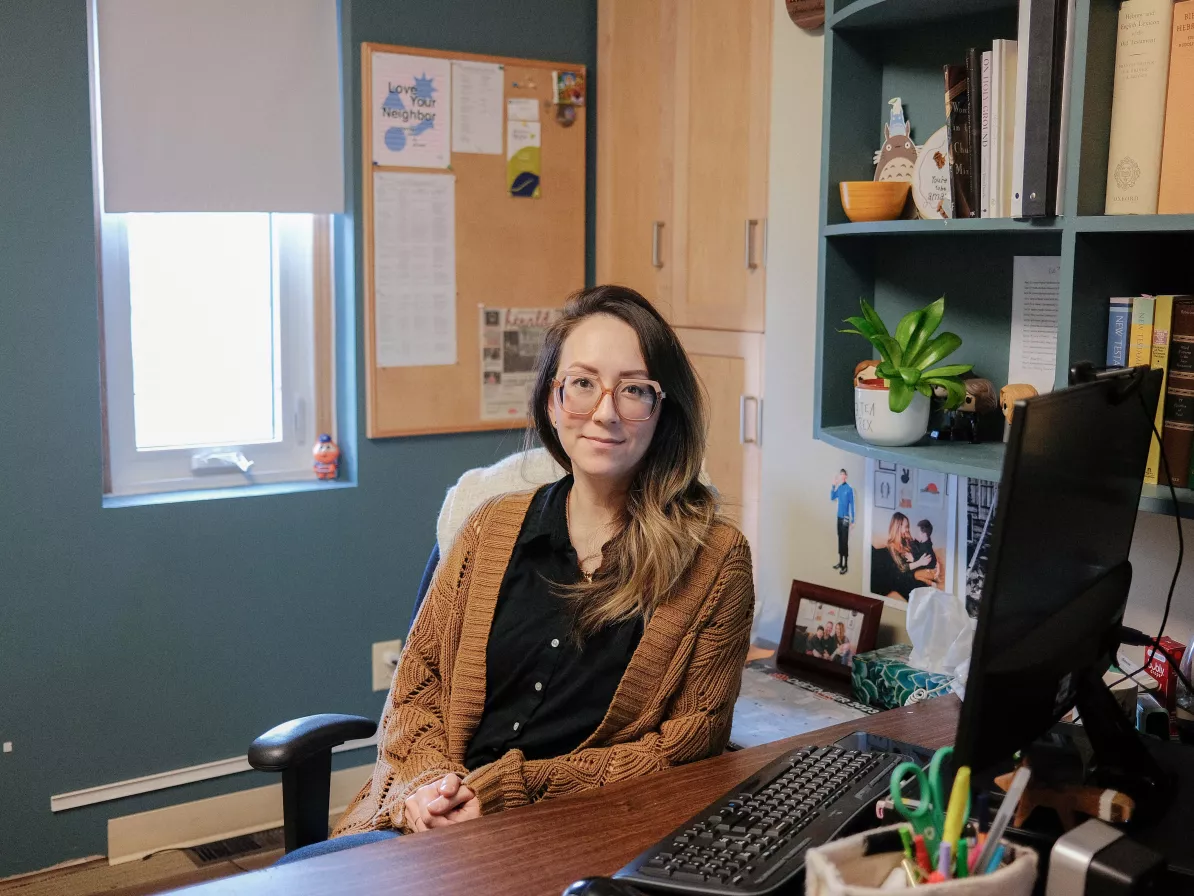 A woman at her desk in an office