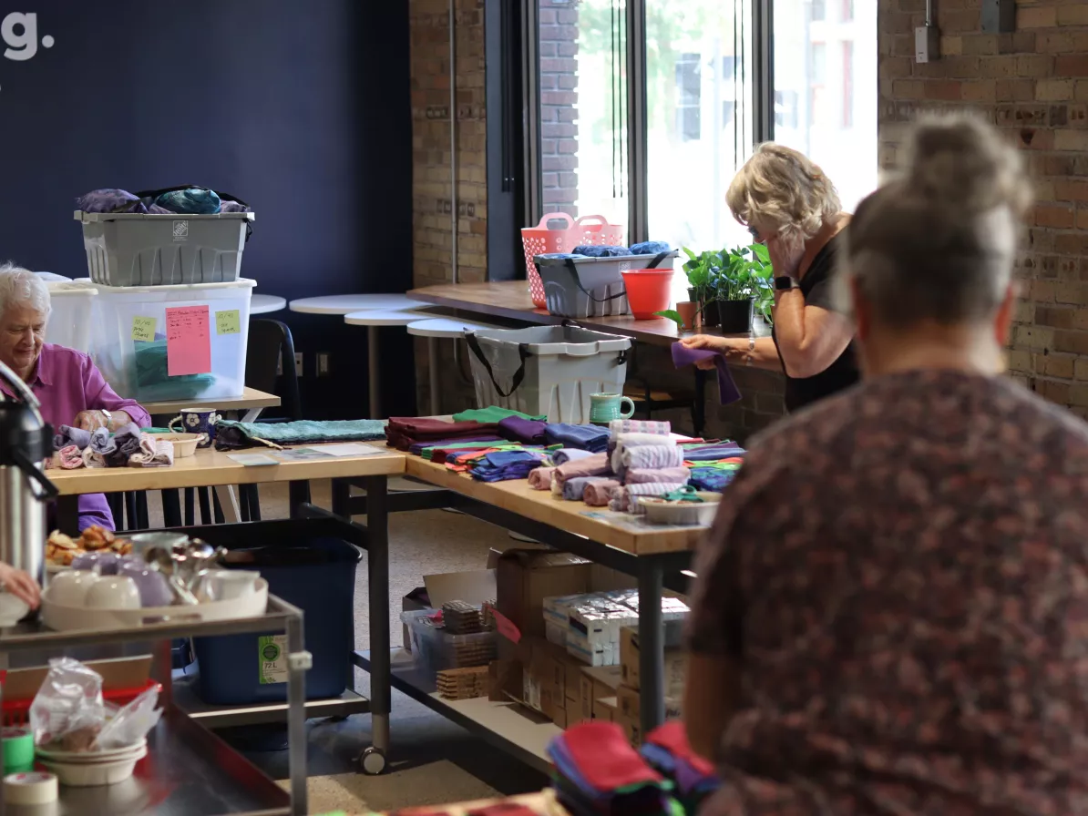 people packing kits together 