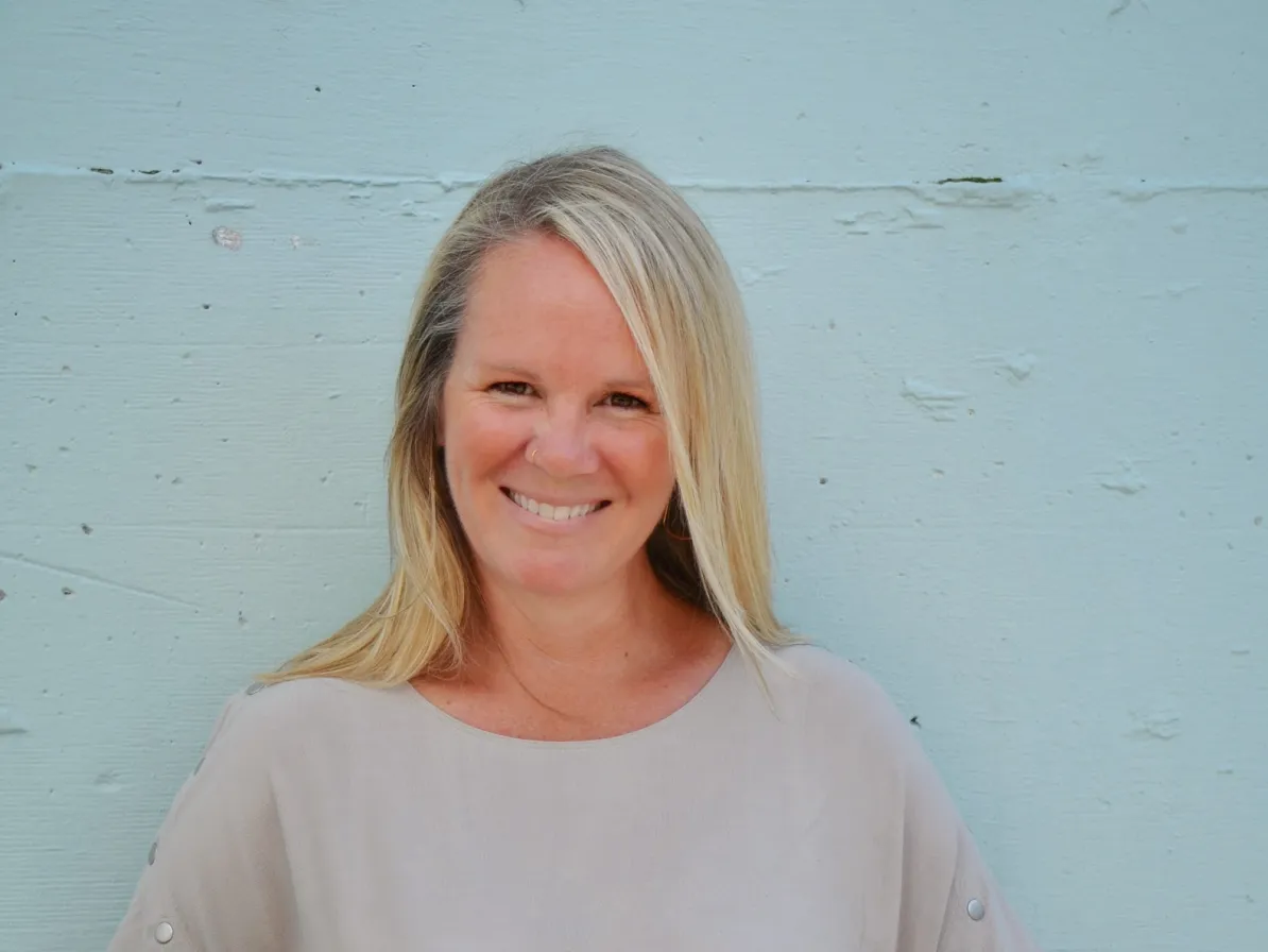 An image of Tara, smiling at the camera