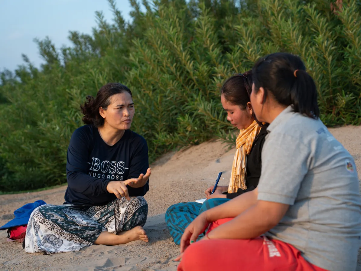 Left to right Koeut Chhunly, Theum Chan Thou, and Sor Navy share in a session led by Koeut Chhunly, Senior Program Coordinator of PBO during a river patrol