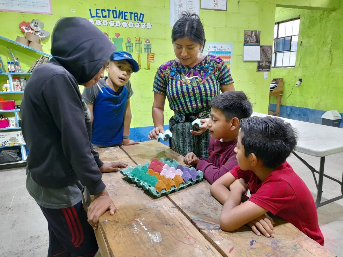MCC partner Asociación Nuevo Amanecer de Santiago Atitlán (ANADESA)  supports educational reinforcement programming for Indigenous Tz'utujil children and youth in rural Guatemala. In this photo, tea
