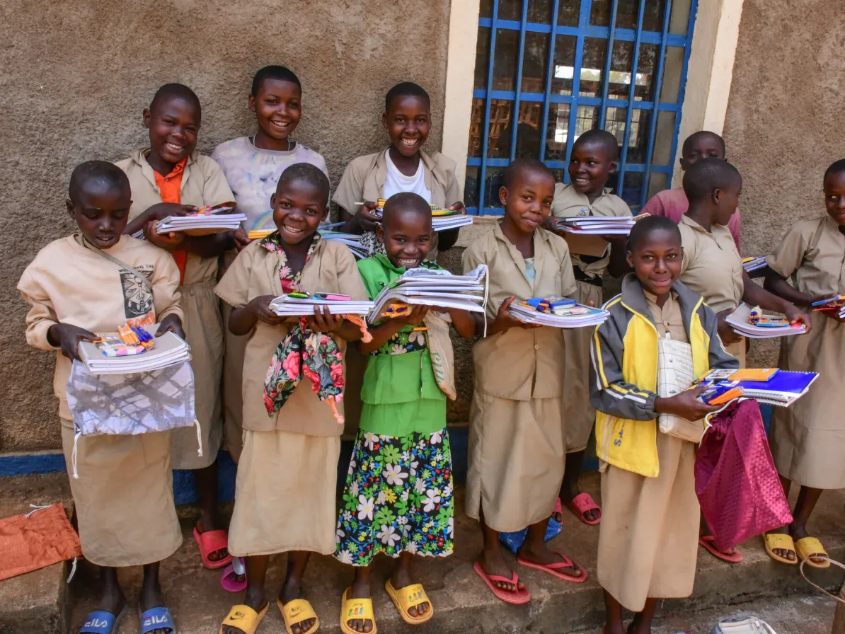 Batwa school children express their joy after receiving MCC school kits. MCC's partner Help Channel Burundi (HCB) held the distribution at Borera primary school, Kayogoro, Makamba Province, Burundi, i