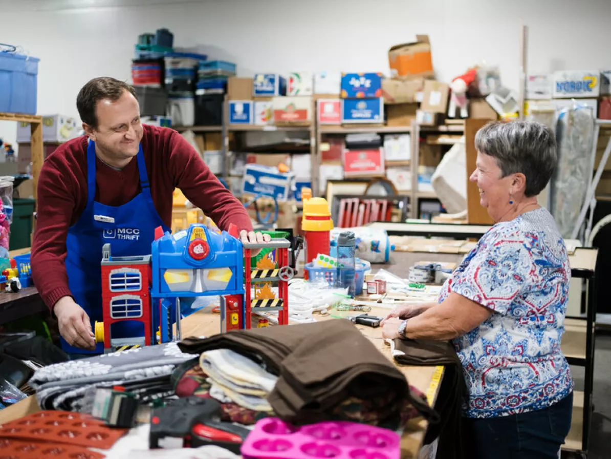 Thrift volunteers Alexander Germann (left) and Janice Wiggins (right) make sure a children's toy donation is in good working order before putting it out on the shop floor.