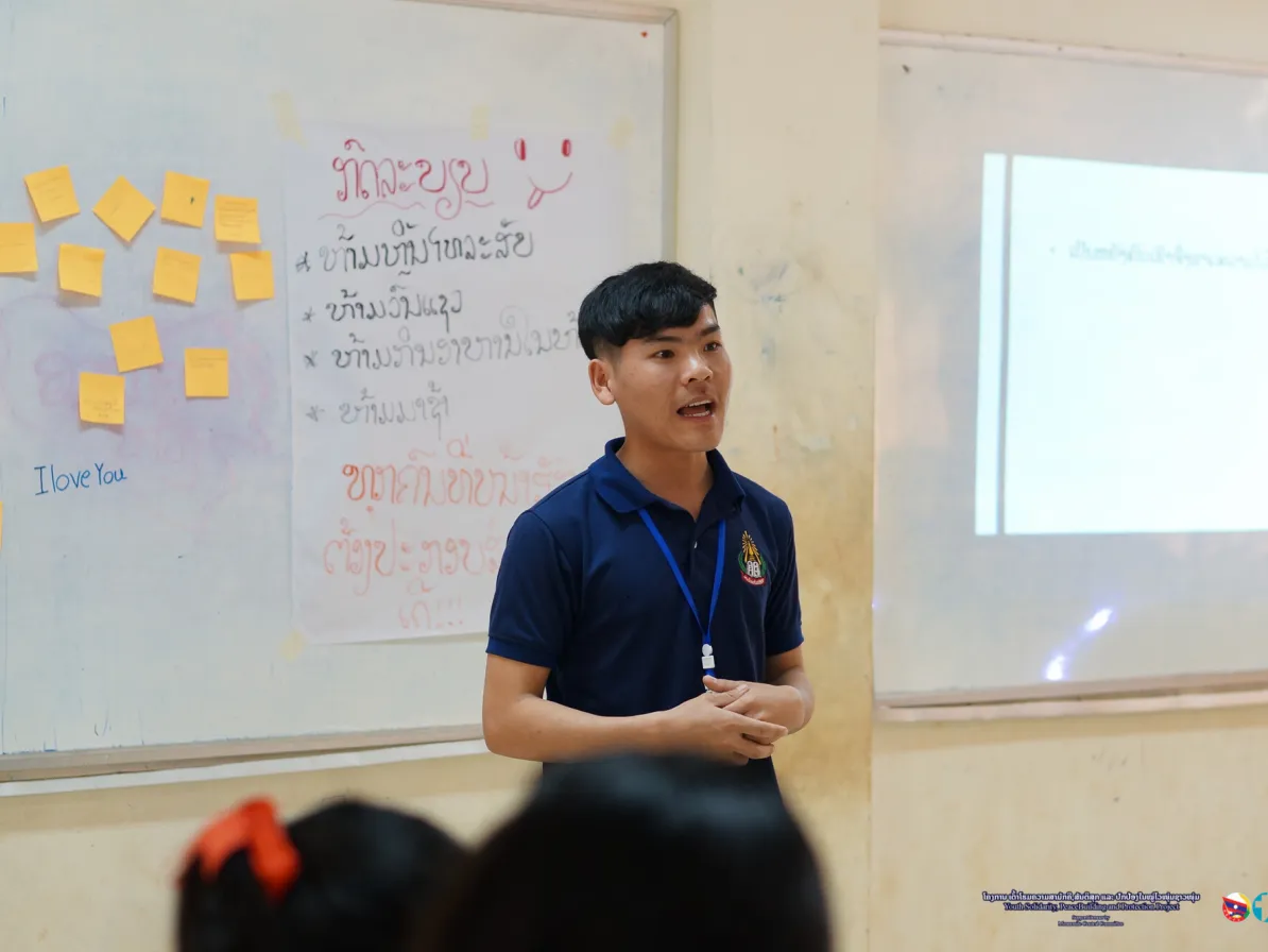 University student and Mittiphab (Friendship), MCC peace club, volunteer, Naiy Xiong  leads a group discussion about respect with grade 11 students In Satthid High School, Vientiane, Lao PDR. MCC work
