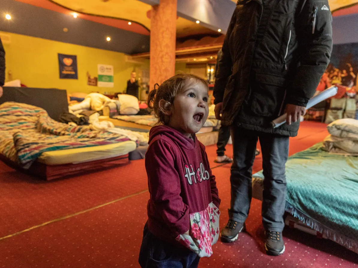 A child* who lives in a large room in the shelter run by Blaho Charitable Fund in Uzhhorod. This room used to be a restaurant in a hotel, but the building is now being rented by Blaho to provide tempo