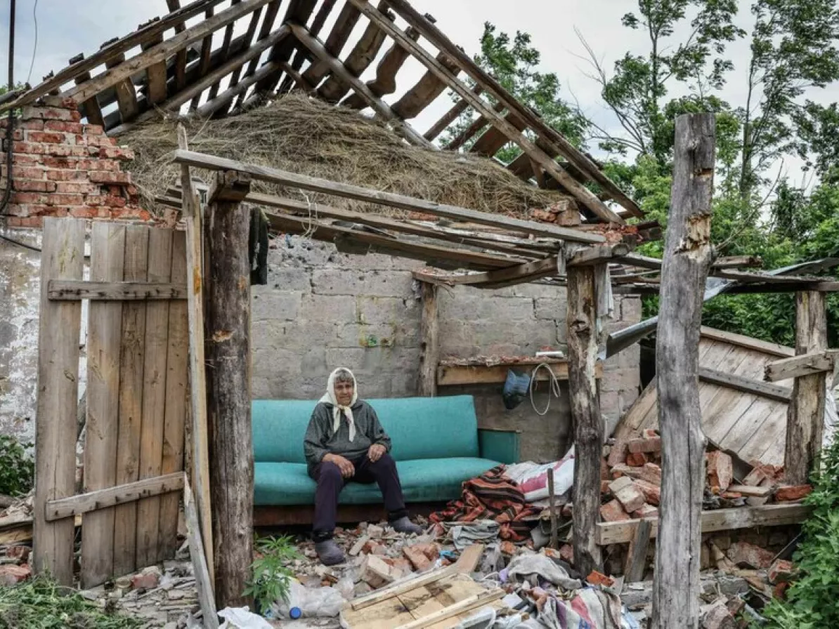 Nadiya* at her destroyed home.
*Her full name and location are not used for security reasons.