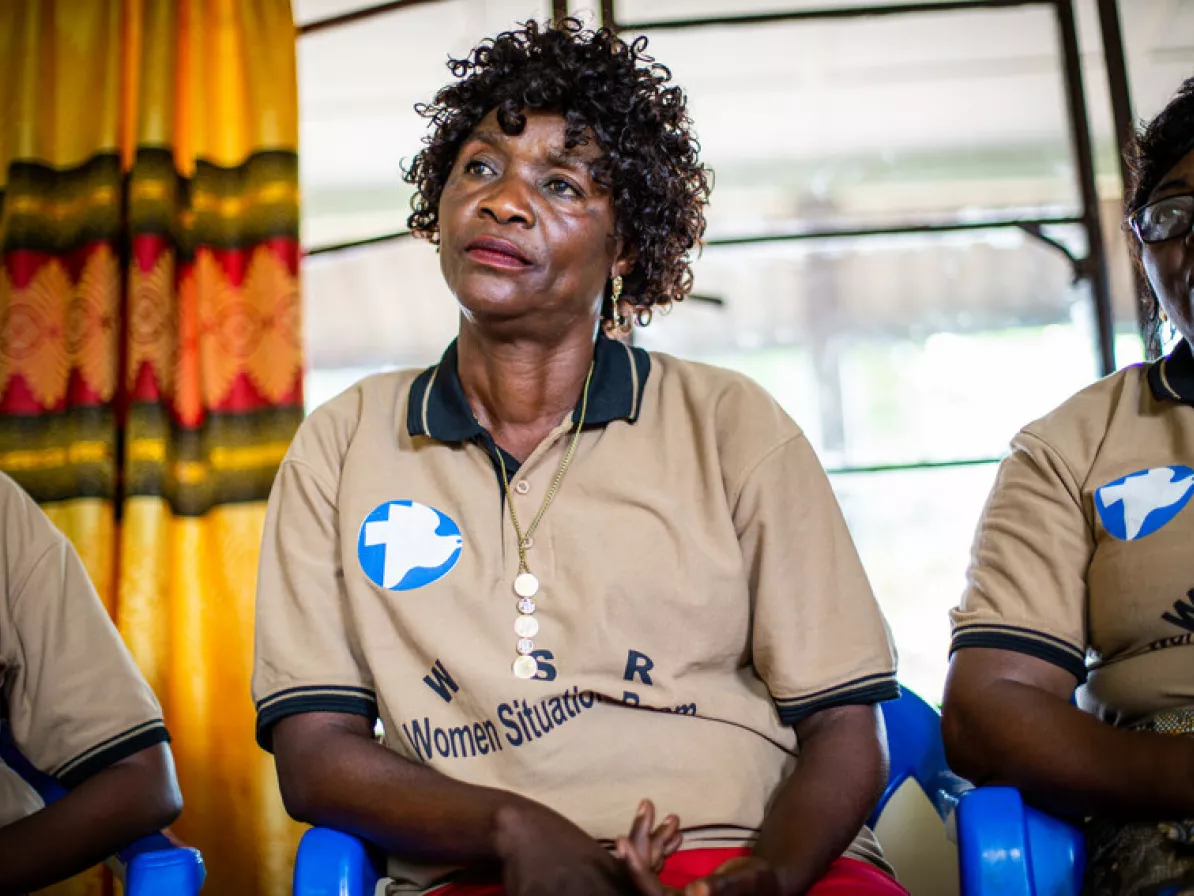 Melanie Mafinga, 53 years old, trader, center, resolved a financial issue that Beatrice Kulenga Makasi (not pictured) had with her daughter. Mafinga and Patience Tomboka, right, are members of the Wom