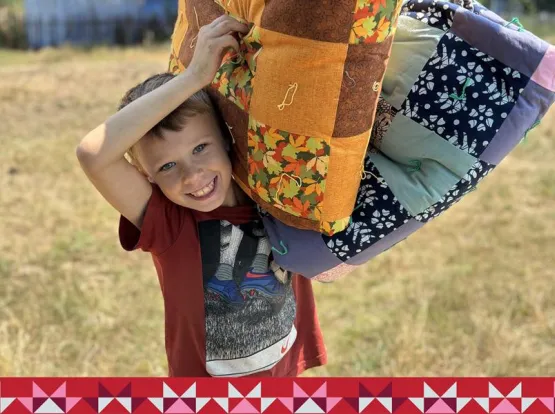 Boy holding a blanket