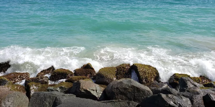 View of the ocean crashing upon rocks