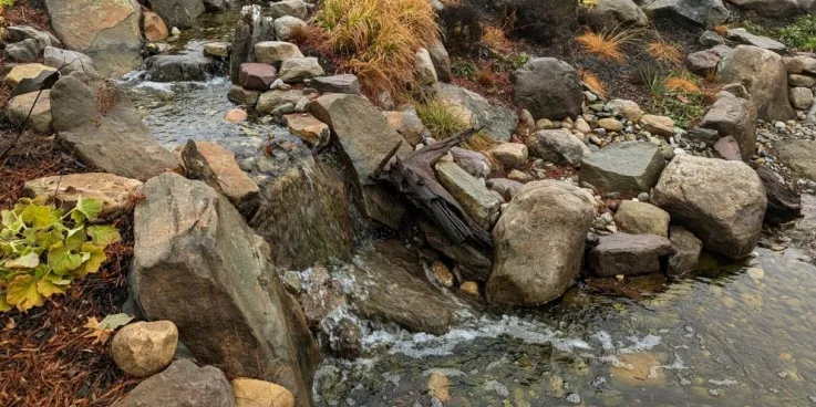 Stream passes through gray rocks