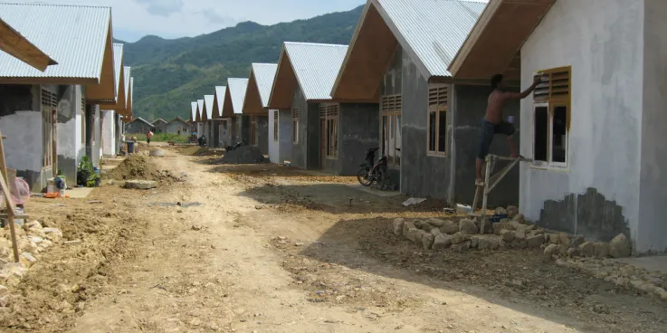 A row of houses in Indonesia that are being worked on.