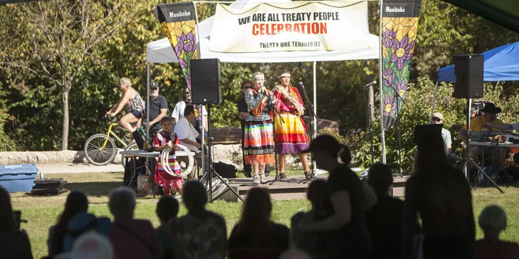 people speaking at stage of We are all treaty people