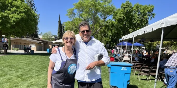 Two people smiling, posing for a photo