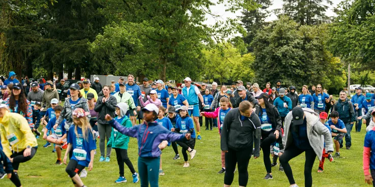A group of people gather in a park
