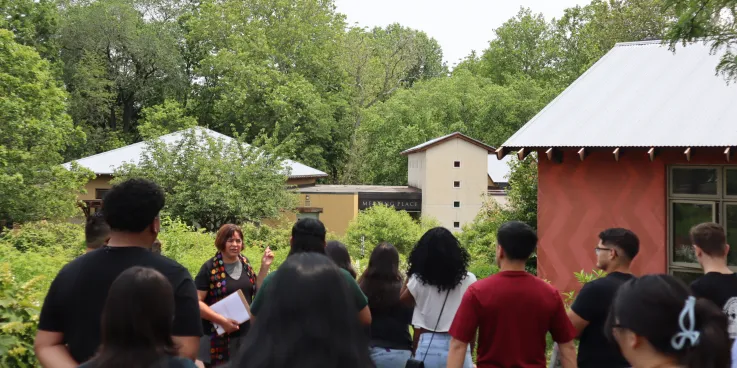 Young adults learn about native plants.
