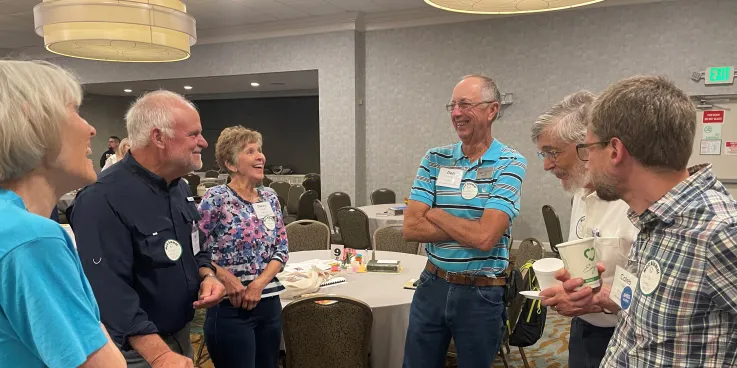 Alumni visit and laugh together