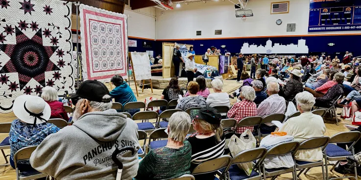 crowd at quilt auction