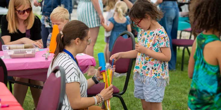 A volunteer and child interacting