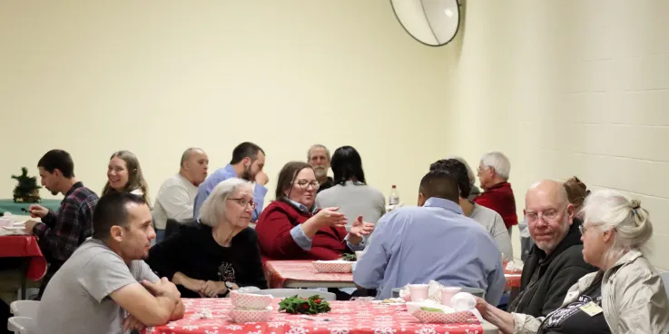 people talking around tables
