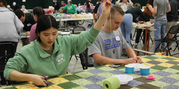 Rosa Kim and Jake Hofstetter were two of the high school seniors from Central Christian School who spent Friday afternoon volunteering at the 2022 Ohio Comforter Bash in Kidron, Ohio.