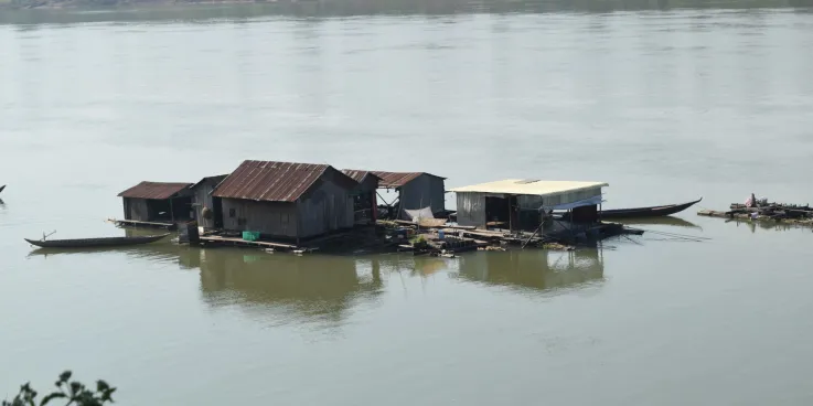 A floating village of "boat people" temporarily anchors on the upstream Mekong river in Kratie province, Cambodia.