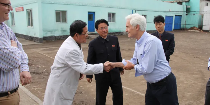 Chris Rice, MCC representative for Northeast Asia, with a pediatric hospital director at a provincial pediatric hospital in the Democratic People’s Republic of Korea (DPRK)*.

	MCC sent 520 cartons