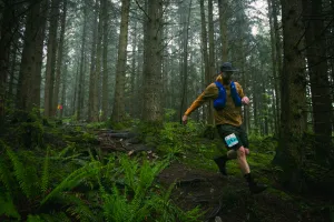 Man running through a forest