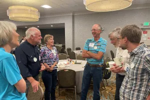 Alumni visit and laugh together