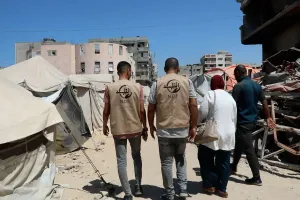 A group of people walking amidst destruction