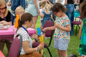 A volunteer and child interacting
