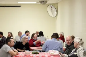 people talking around tables