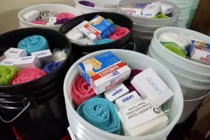 Relief kits await lids at the Material Resources Center in Ephrata, PA. Relief kits include:

	
		4 large bars bath soap 
	
		1 plastic bottle shampoo (13–24 oz; place in resealable plastic bag)