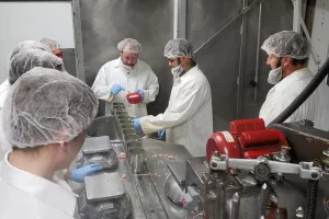 Caption: Volunteers in Newton, Kansas, put a teaspoon of salt in the cans before filling them with ground chicken. MCC photo/Josh Voth


More information: Volunteer groups representing Amish, Beach