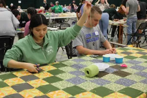 Rosa Kim and Jake Hofstetter were two of the high school seniors from Central Christian School who spent Friday afternoon volunteering at the 2022 Ohio Comforter Bash in Kidron, Ohio.