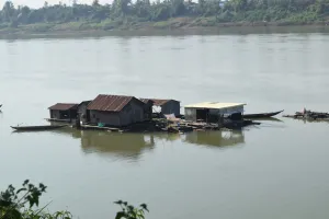 A floating village of "boat people" temporarily anchors on the upstream Mekong river in Kratie province, Cambodia.