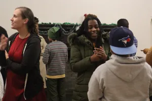 Participants in the week-long "Peace for the Weary" camp for young adults, held at Camp Deerpark in Westbrookville, New York, engage in a conversation circle during a debrief and closing activity at a