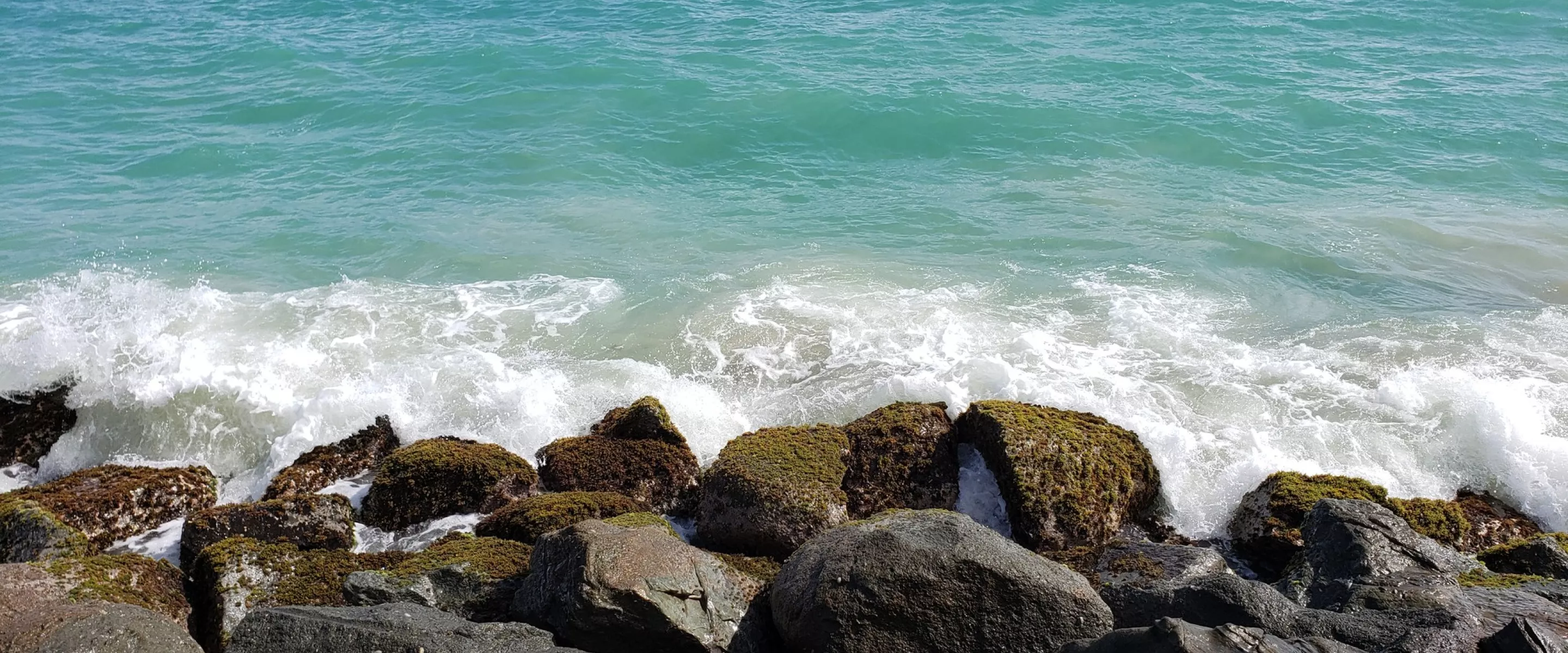 View of the ocean crashing upon rocks