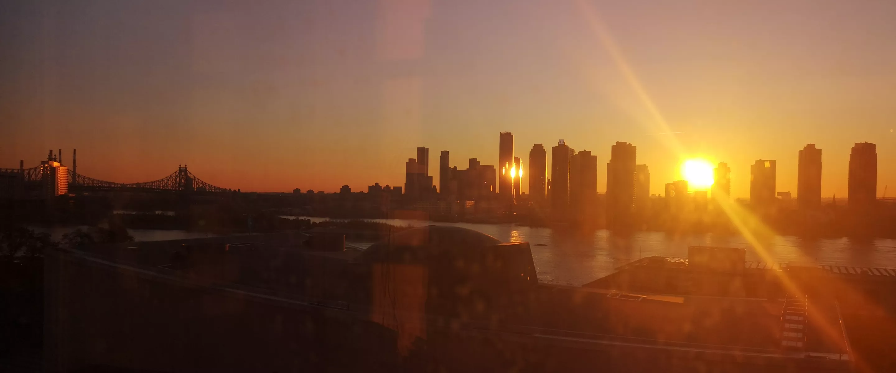 Sunset over the East River and the UN complex, from the view of the MCC UN office in New York City.