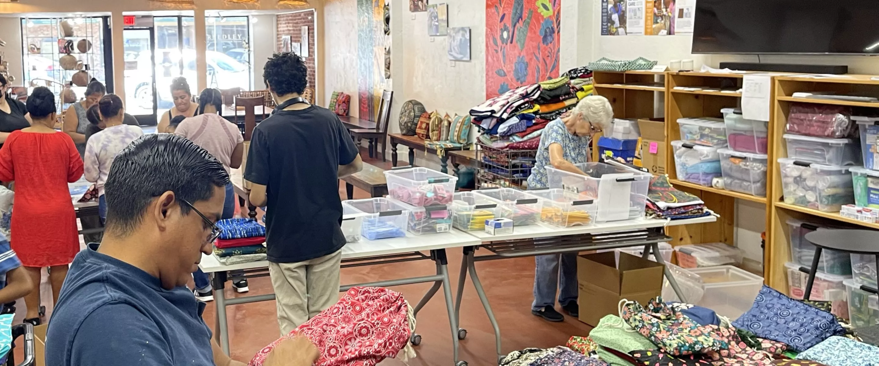 Group of people packing and checking school kits