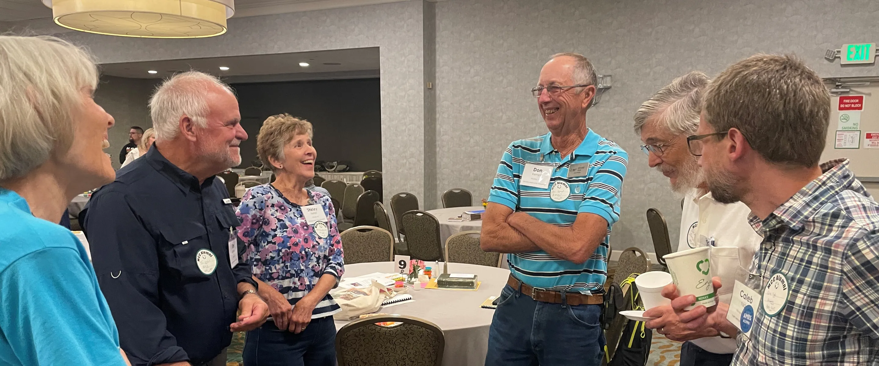 Alumni visit and laugh together