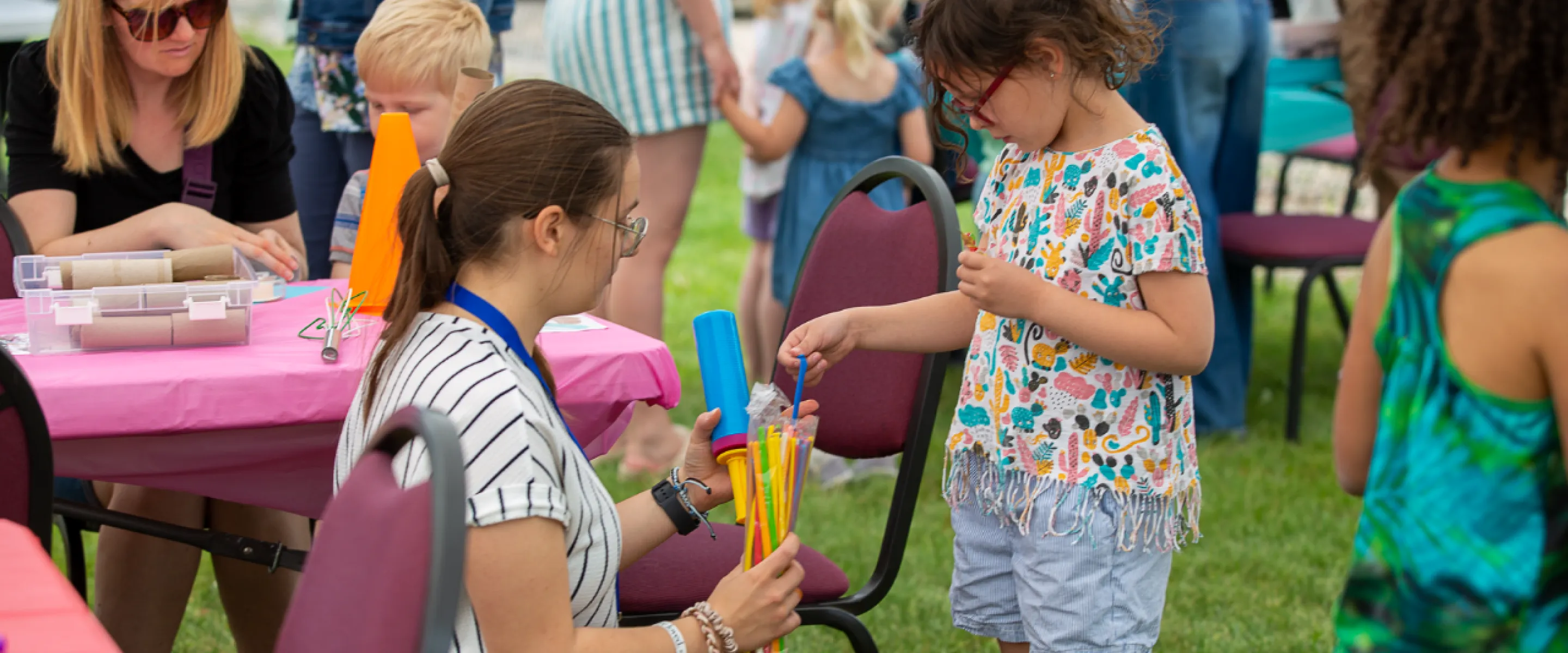A volunteer and child interacting