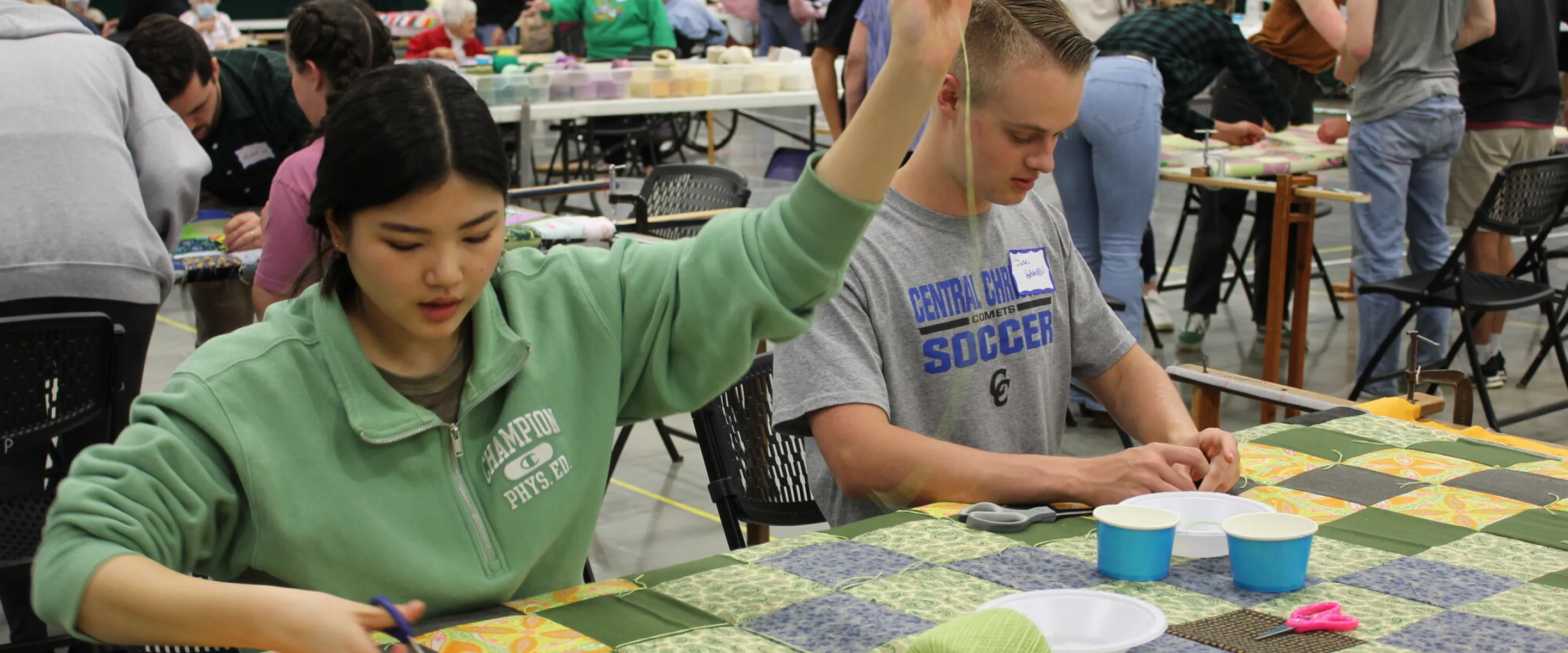 Rosa Kim and Jake Hofstetter were two of the high school seniors from Central Christian School who spent Friday afternoon volunteering at the 2022 Ohio Comforter Bash in Kidron, Ohio.