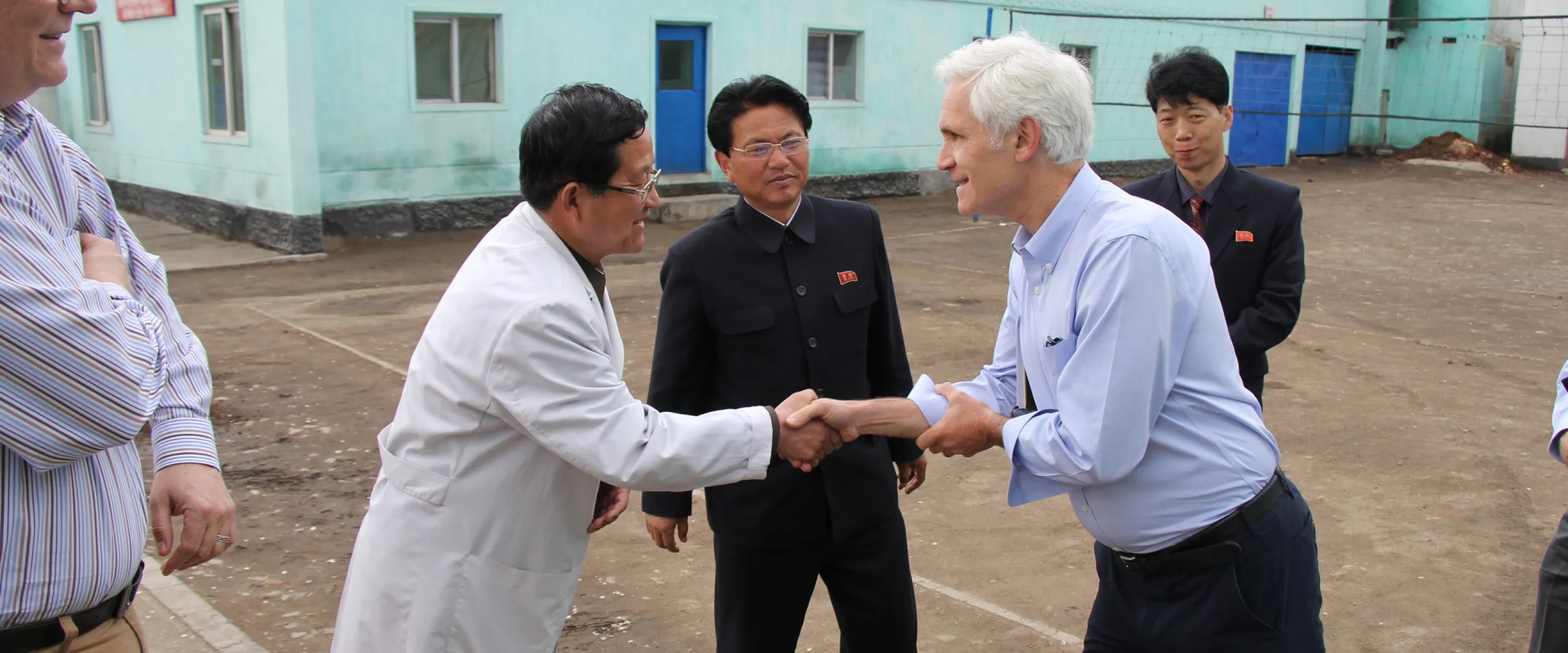 Chris Rice, MCC representative for Northeast Asia, with a pediatric hospital director at a provincial pediatric hospital in the Democratic People’s Republic of Korea (DPRK)*.

	MCC sent 520 cartons