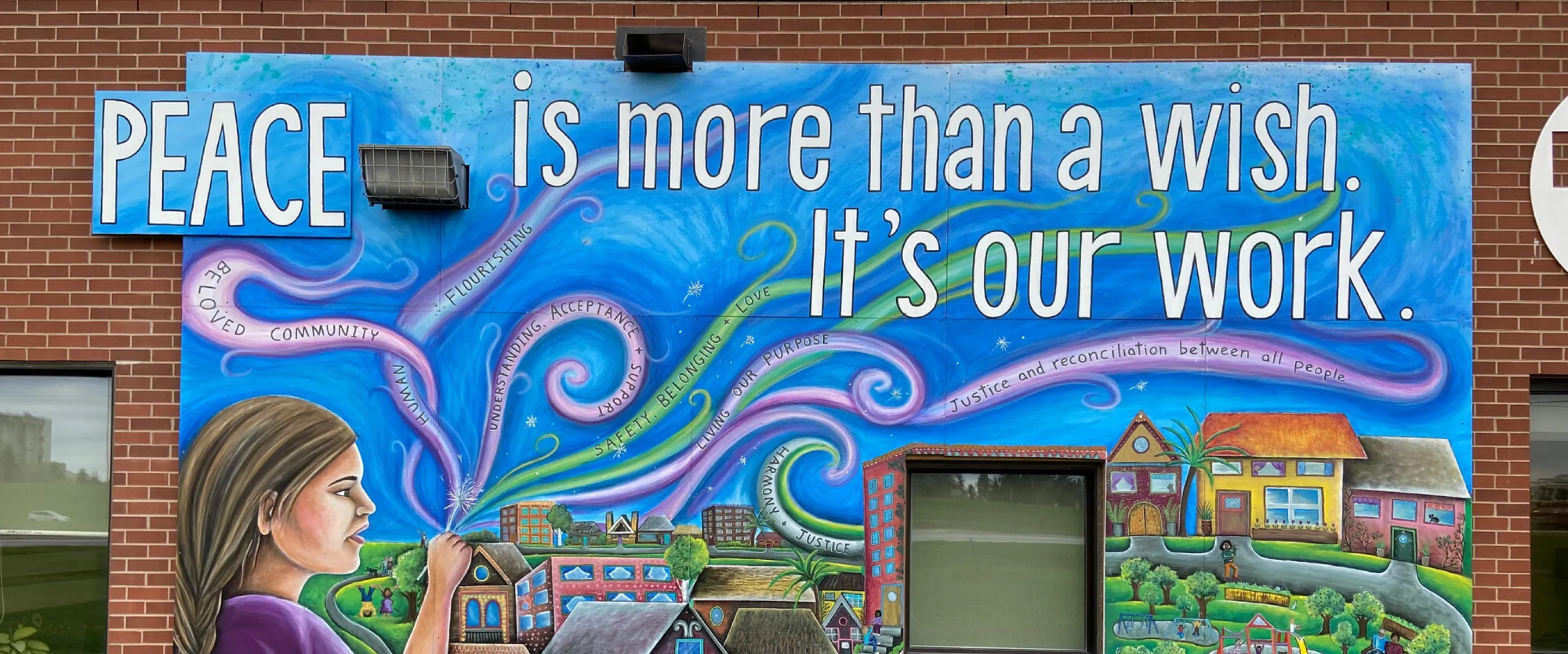 More Than A Wish (MTAW) mural on the south side of the head office at Plaza Drive, Winnipeg. Created by Annie Bergen.Annie is a muralist as well as an arts educator who creates group mural project